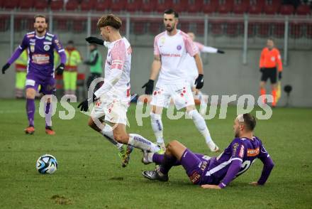 Fussball Bundesliga. SK Austria Klagenfurt gegen FK Austria Wien.   Rico Benatelli,  (Klagenfurt),   Muharem Huskovic  (Wien).  Klagenfurt, am 9.12.2023.
Foto: Kuess
---
pressefotos, pressefotografie, kuess, qs, qspictures, sport, bild, bilder, bilddatenbank