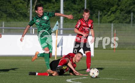Fussball. Kaerntner Liga. Landskron gegen ATUS Ferlach.  Daniel Arneitz (Landskron),  Martin Posratschnig (Ferlach). Landskron, am 29.5.2024.
Foto: Kuess
www.qspictures.net
---
pressefotos, pressefotografie, kuess, qs, qspictures, sport, bild, bilder, bilddatenbank