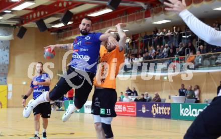 Handball Bundesliga. SC Ferlach gegen HSG Holding Graz.  Milicevic Adrian  (Ferlach),     Albek Joszef (Graz).  Ferlach, am 23.11.2024.
Foto: Kuess
www.qspictures.net
---
pressefotos, pressefotografie, kuess, qs, qspictures, sport, bild, bilder, bilddatenbank